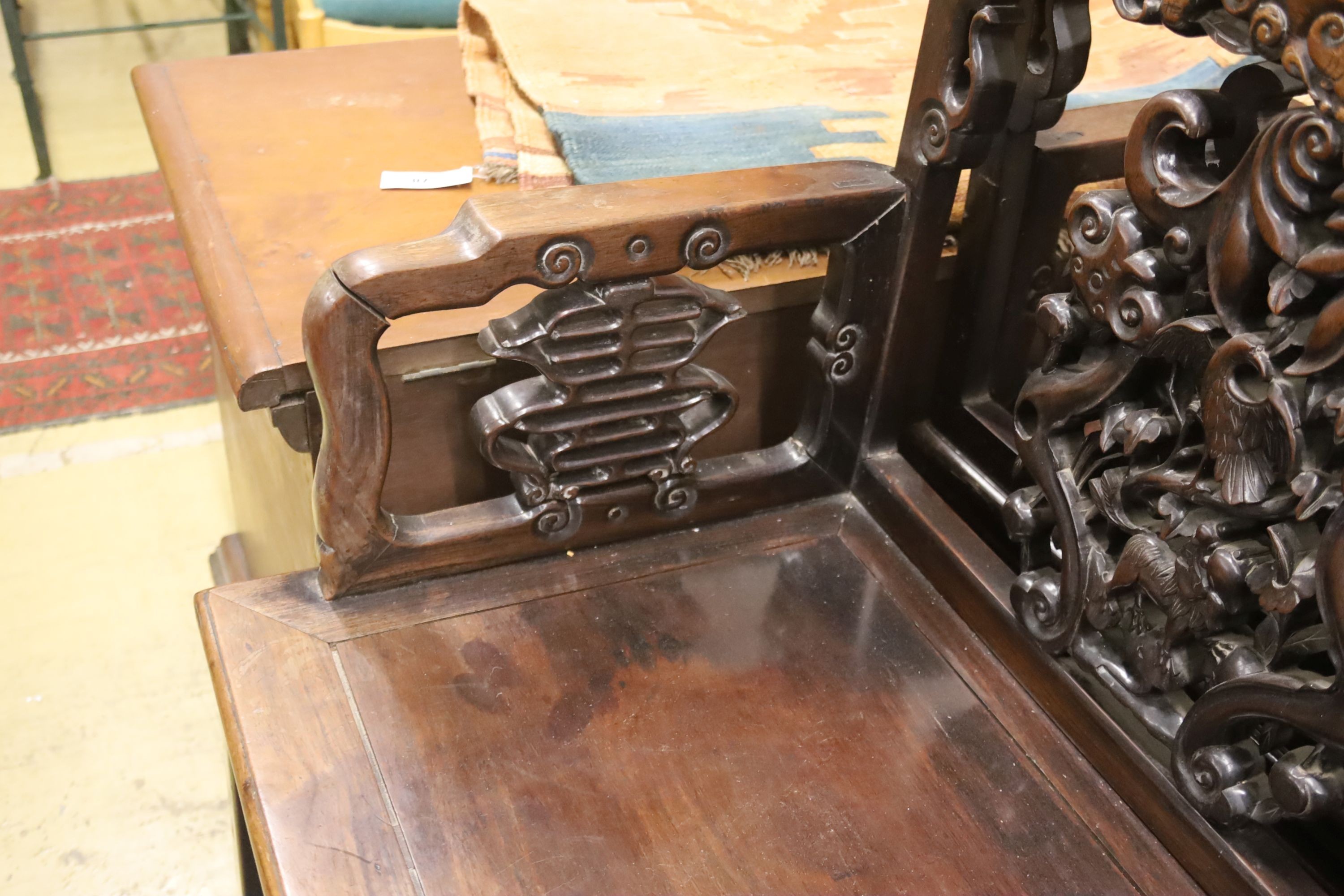 A pair of Chinese carved hongmu elbow chairs (a.f.), width 65cm, depth 48cm, height 96cm